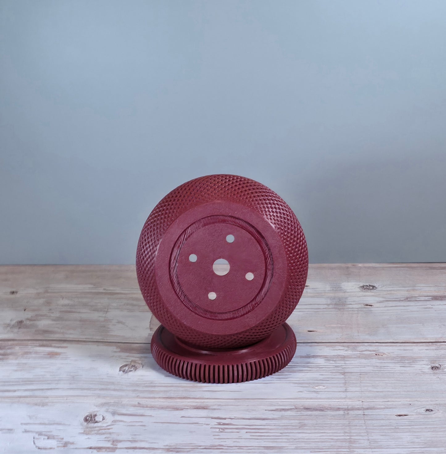 Maroon Mesh Planter with Round Drip Tray against Light Grey Background