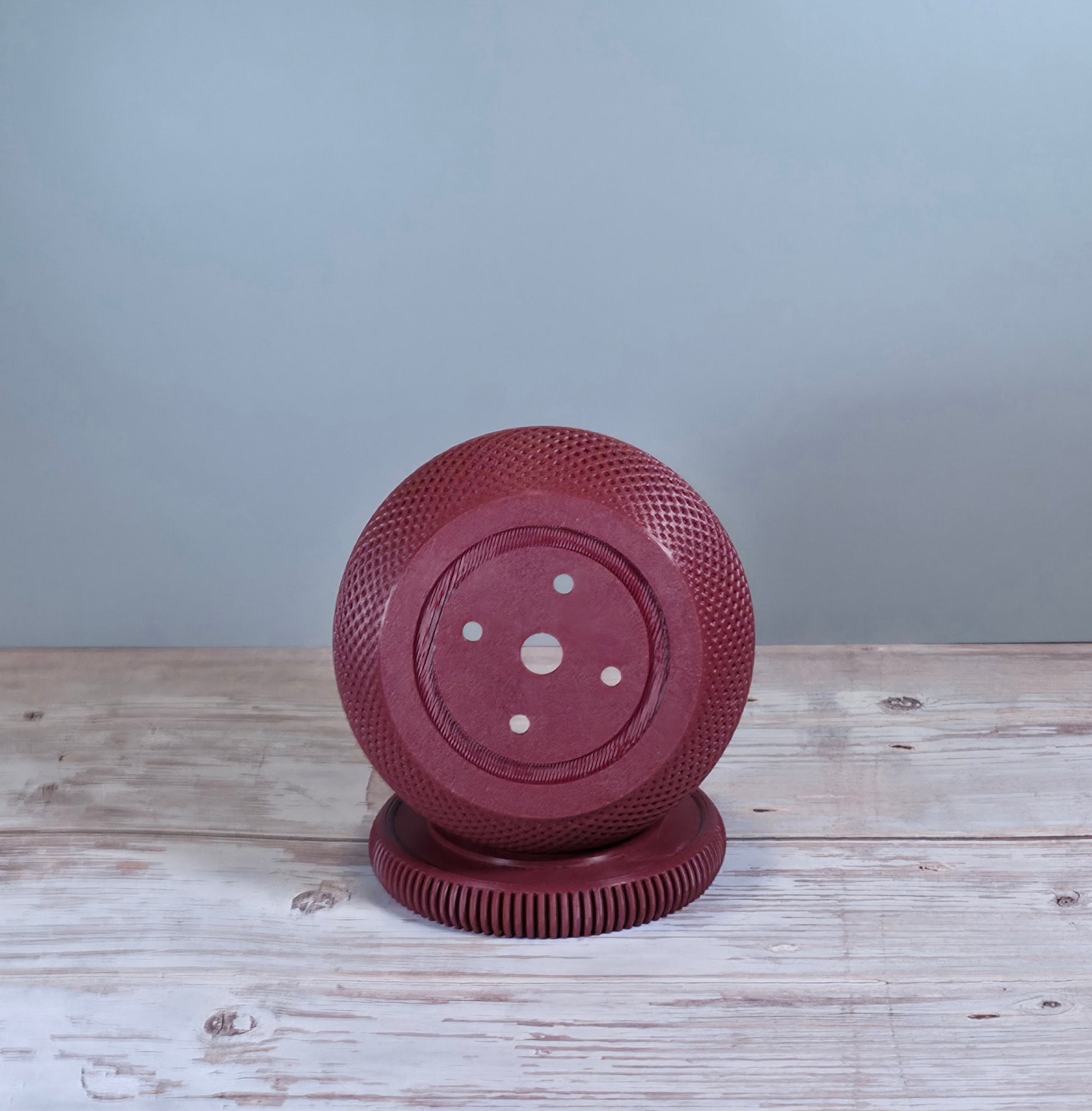 Maroon Mesh Planter with Round Drip Tray against Light Grey Background