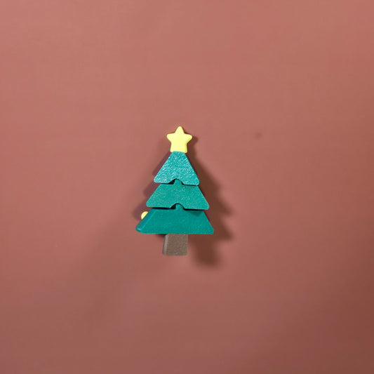Christmas tree-shaped object with a yellow star on a brown background