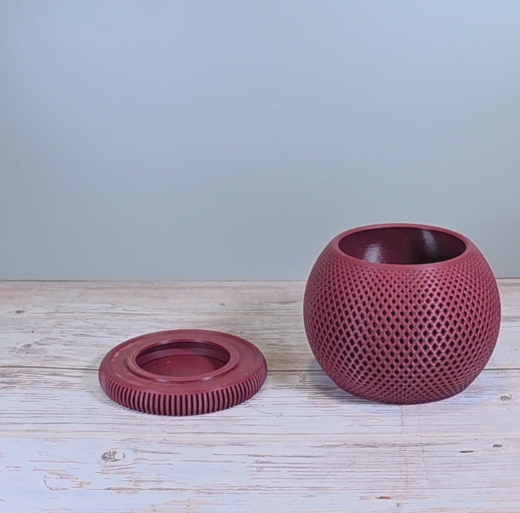 Maroon Mesh Planter with Round Drip Tray against Light Grey Background