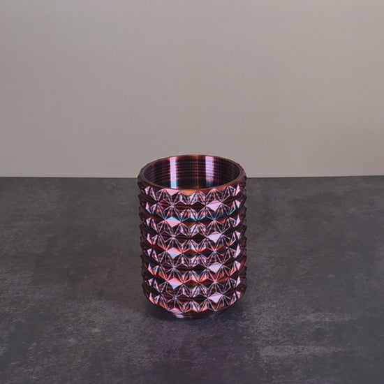 Red Cup with Black Stripes and Geometric Texture against Stone Background